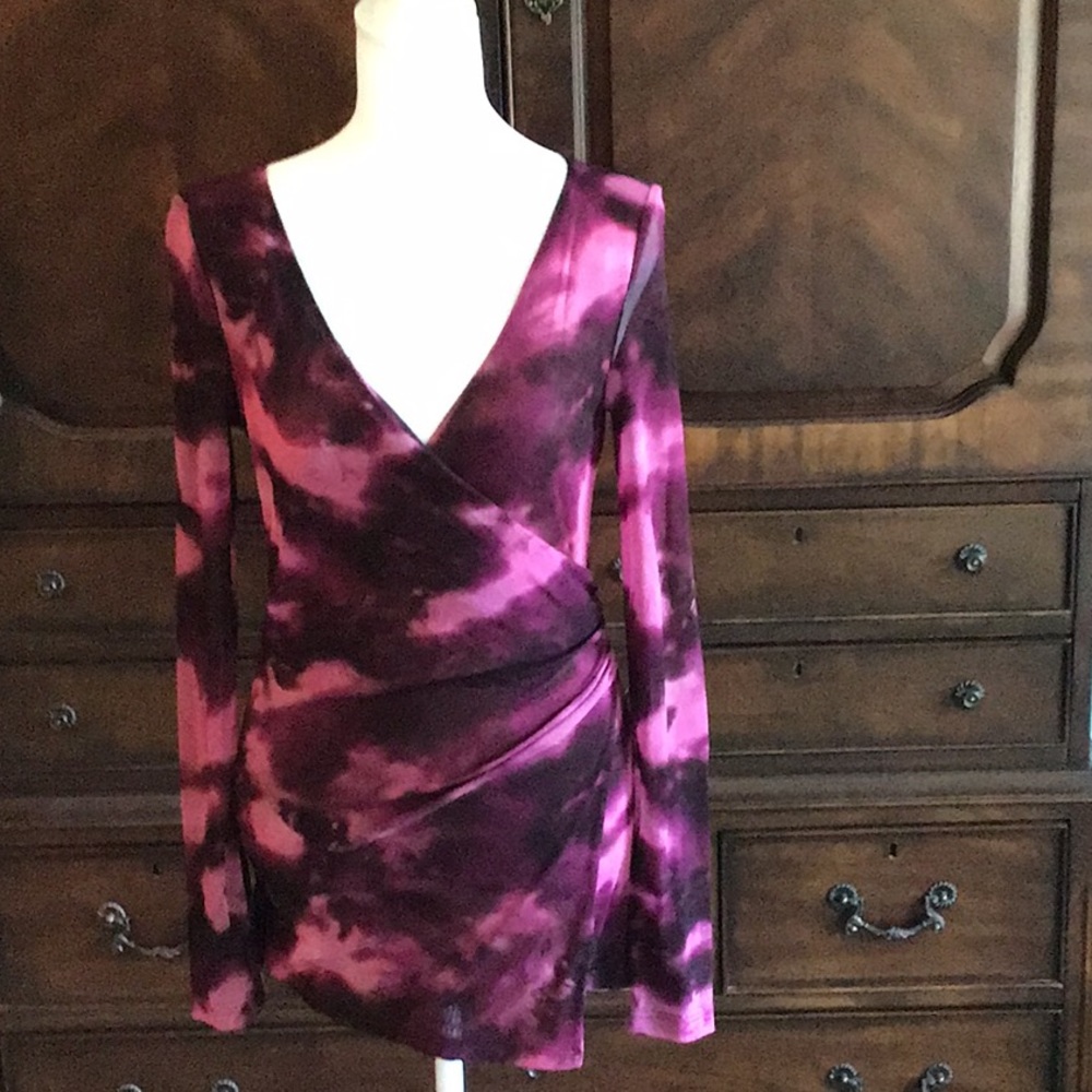 INC crossover style top with stretchy, form fitting fabric. Asymmetrical front.